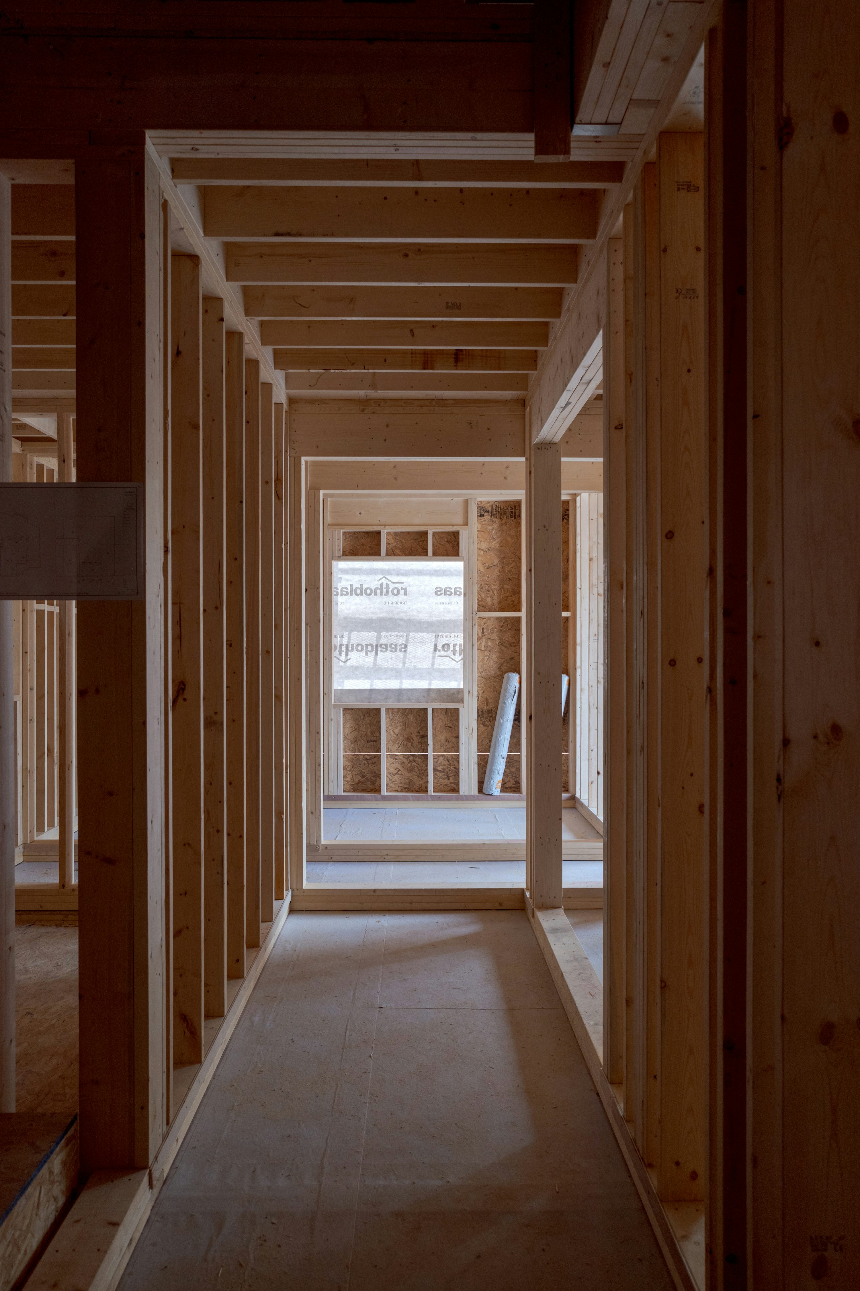 Illustrative unfinished interior with exposed wood framing